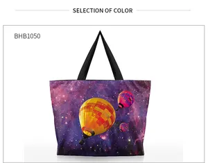 Macro shot of 3D galaxy and hot air balloon print on purple crossbody tote bag