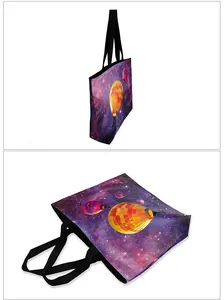 Detail of 3D galaxy tote bag with vibrant hot air balloon print and black handles
