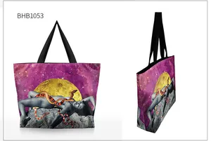 Detail view of starry sky tote bag with artistic moon print and black woven handles