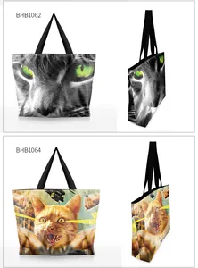 Detail view of canvas tote bags with 3D cat prints and black shoulder straps