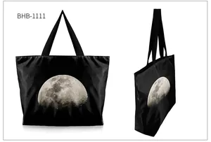 Detailed macro view showing high-definition moon print on a black nylon shoulder tote bag