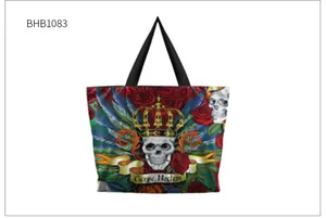 Close-up of gothic tote bag with skull, roses, and Carpe Noctem artistic print