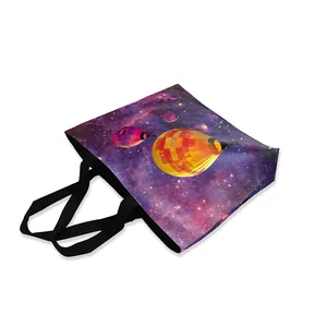 Starry sky and hot air balloon print canvas tote bag with black durable handles