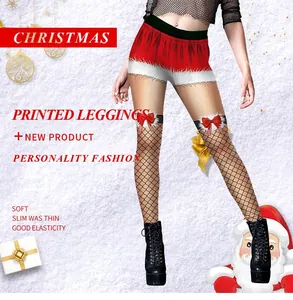 Detailed view of Christmas leggings with red shorts print and faux fishnet bow detail