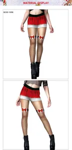 Detailed view of Christmas print leggings with layered red skirt and bow design