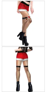 Detailed view of Christmas themed red shorts with white faux fur and black fishnet stockings