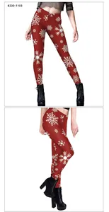 Detail of red Christmas leggings featuring white snowflake print and high waist fit