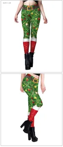 Detailed view of Christmas leggings with festive pine needles and red boot print