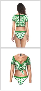 Detail showing 3D digital St. Patrick's Day clover print on long sleeve swimsuit fabric