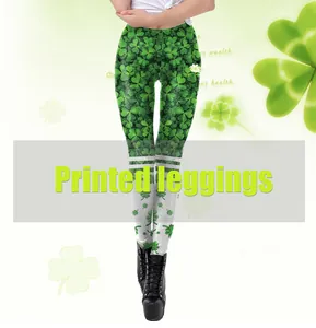 Detail view of St. Patrick's Day leggings with green clover patterns and white stripe accents