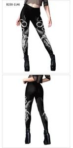 Detailed view of high-waist gothic leggings featuring white goat skull print on black fabric