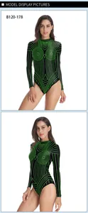 Detail view of long-sleeve bodysuit with neon green geometric lines on black fabric
