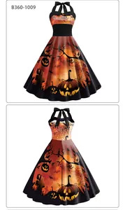 Détails de la robe d'Halloween montrant des motifs citrouille et toile d'araignée sur tissu noir