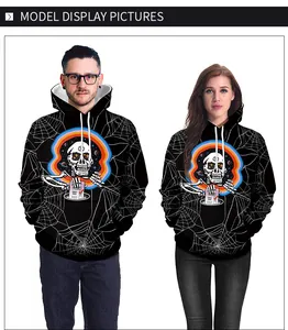 Detail of Halloween hoodie with white spider web patterns and colorful skull print