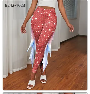 Detail of red mermaid leggings with white spots and blue scale-like side fin decorations