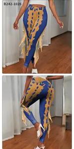 Detail of mermaid leggings featuring scale digital print and layered fringe side trim