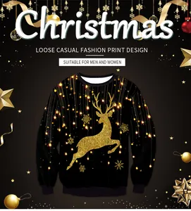 Detail van de gouden glitter rendier en sneeuwvlok print op zwarte kerst sweatshirt