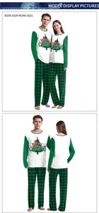 Detail of Christmas couple pajamas featuring Merry Christmas print and plaid pants