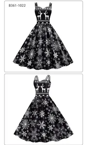 Detail view of Christmas A-line dress featuring white reindeer and snowflake prints