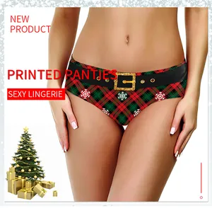 Close-up of women's Christmas panties featuring red plaid print and festive snowflake details