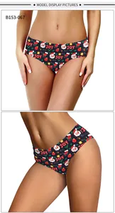 Detail of women's Christmas panties with Santa and JOY prints on black fabric