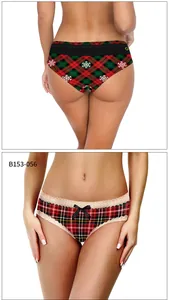 Detail of Christmas plaid panties with snowflake print and red lace bow accents