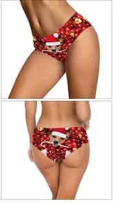 Detail of women's Christmas panties featuring cute dog prints and red holiday ornaments