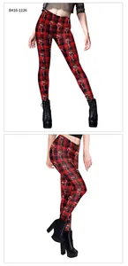 Detail view of red buffalo plaid leggings featuring a festive Christmas wine glass design