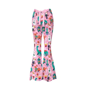 Pantalon évasé rose avec motifs de Noël de bande dessinée et décoration de nœud
