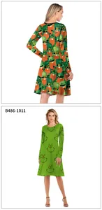 Detail view of festive St. Patrick's clover and Grinch-inspired printed long sleeve dresses