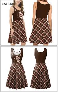 Detail of sleeveless A-line dress featuring heart print and plaid skirt pattern