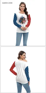 Dettaglio maniche con stampa stelle bandiera americana su top bianco a maniche lunghe