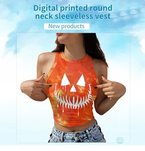 Detail of orange tie-dye Halloween crop top featuring digital pumpkin face print