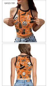 Detail view of Halloween crop top featuring pumpkin, skull and bat prints on orange fabric