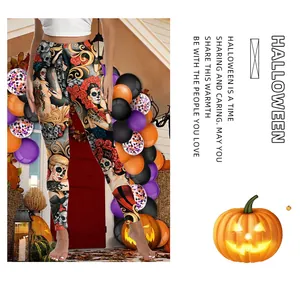 Close-up of Day of the Dead leggings with sugar skull and rose digital print pattern