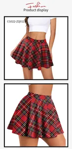 Detail view of high waisted red plaid pleated skirt with Scottish tartan pattern
