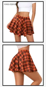 Detail view of orange plaid pleated mini skirt with high-waisted A-line silhouette
