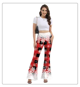 Close-up of Christmas flare pants featuring red buffalo plaid and white snowflake prints
