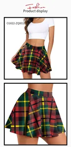 Detail view of red plaid pleated Christmas skirt featuring festive tartan pattern and flare