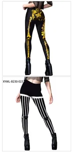 Detail view of Halloween leggings featuring skull roses and striped cat patterns