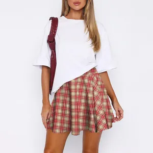 Women Christmas red plaid pleated mini skirt paired with a white short sleeve T-shirt