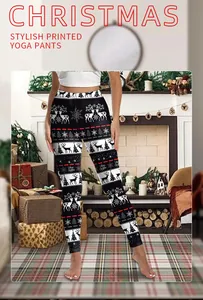 Christmas yoga pants featuring reindeer and snowflake prints in a cozy home setting