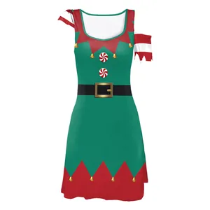 Detail of Christmas elf dress with green fabric, red jagged edges and bell print accents