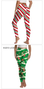 Detail of Christmas leggings featuring festive stripe and holiday ornament digital prints
