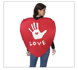 Detail of red heart sponge costume with white palm print and artistic LOVE lettering