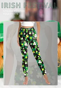 Detail of Irish clover printed yoga pants with festive shamrock patterns on black fabric