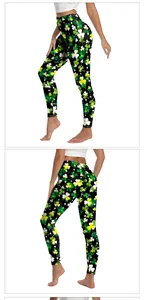 Detail view of high-waisted St. Patrick's Day yoga leggings with green clover digital print