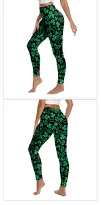 Close-up of high-waist yoga leggings with green shamrock and horseshoe festive print