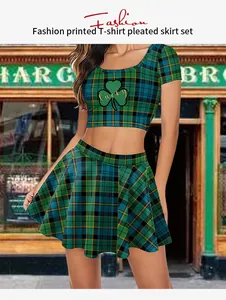 Detail of plaid pleated skirt and cropped T-shirt with clover lucky print for women