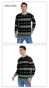 Detail of green ribbed neckline and Nordic clover pattern on black sweatshirt